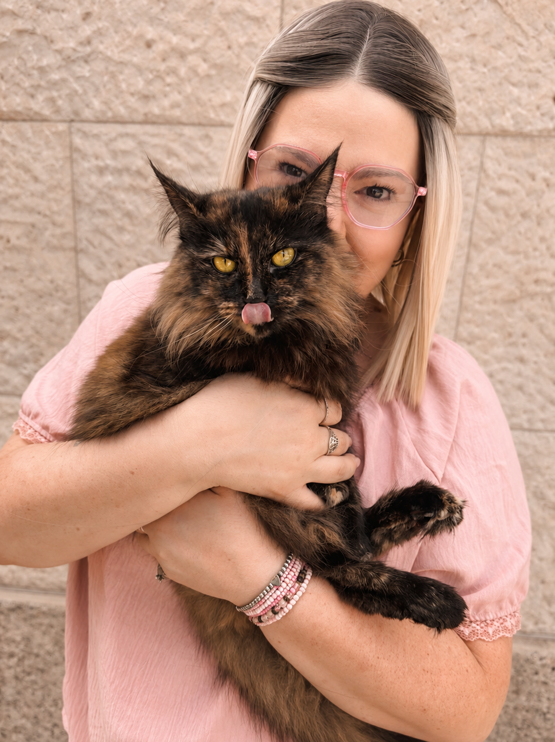Author Alane Theriault holding her cat